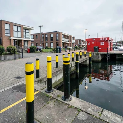 Danish design infrastructure, hygge mechanics, Harbor bollards in yellow and bla