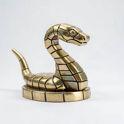 Flat geometric enemy sprite of a wind-up snake boss with brass scales