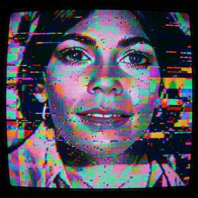 CRT monitor close-up showing RGB phosphor triad pattern, scan lines visible