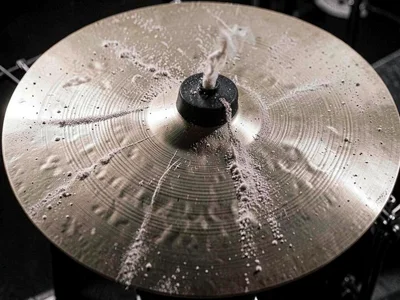Cymbal surface showing nodal lines in fine powder at high frequency