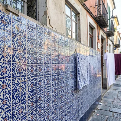 Azulejo tile geometry, Portuguese ceramic culture, Laundry drying on a line agai
