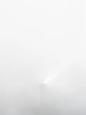 Lighthouse beam cutting through dense fog, everything else lost in white