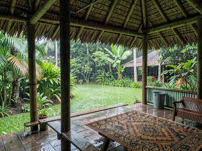Open-air fale life in Samoa after rain, Open-air fale with no walls, looking out