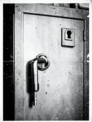 A filing cabinet handle and keyhole, zoomed and re-copied into monumental abstra