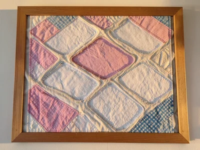 Salt flats as bleached white muslin with geometric evaporation ponds in pink and