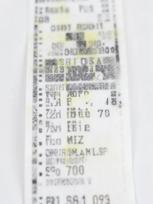 Thermal receipt from Christmas shopping marathon, long scroll of gifts, fading