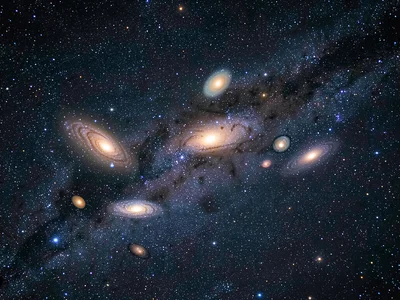 A galaxy group — five or six galaxies of different sizes and types clustered in 