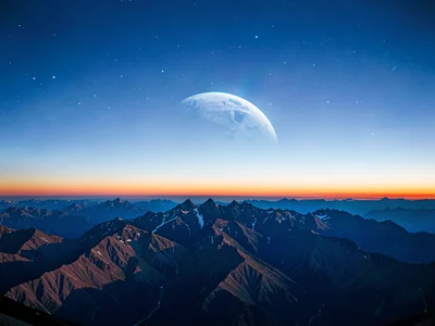 The blue shadow of Earth rising as gradient above mountain horizon