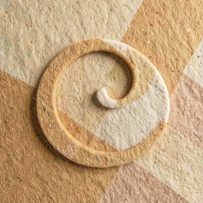 Looped vector flourish forming a closing curl, warm ochre and bone tones, tactil
