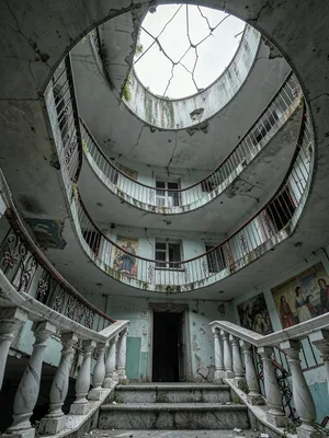 Grand Circular Stairwell Looking Up to Cracked Skylight
