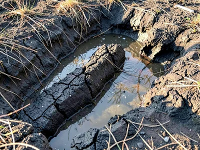 Ash layer with rain channels cutting through