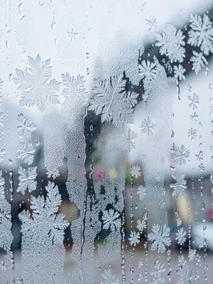 Morning frost on window glass looking crystalline and cold