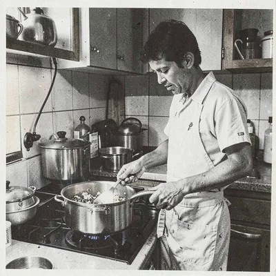 Risograph-style illustration, person cooking in kitchen , spot color layer simul