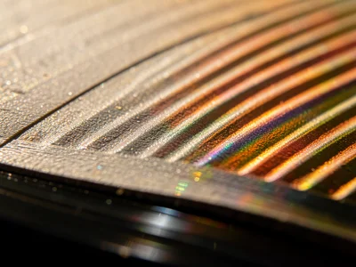 Record label edge transition, where smooth paper label meets grooved vinyl surfa