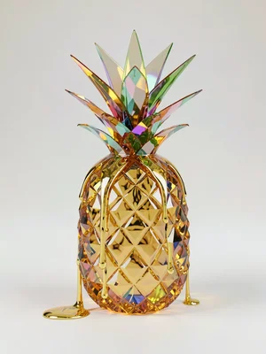 Tall citrine pineapple standing upright on a soft pale gradient with a golden ca